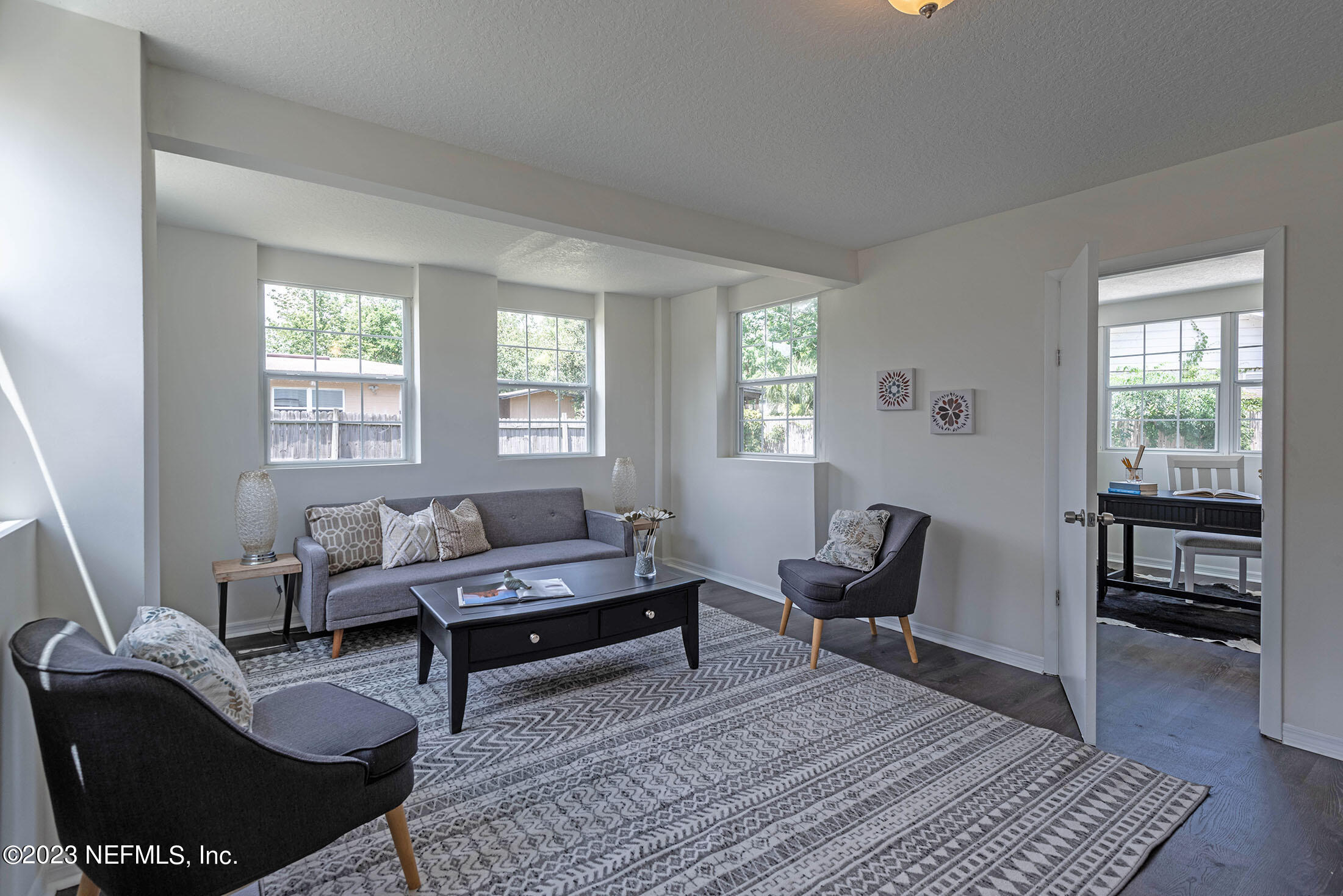 8007 Alderman Road Jacksonville, FL 32211 - Photo 20 of 63 a living room with furniture and wooden floor