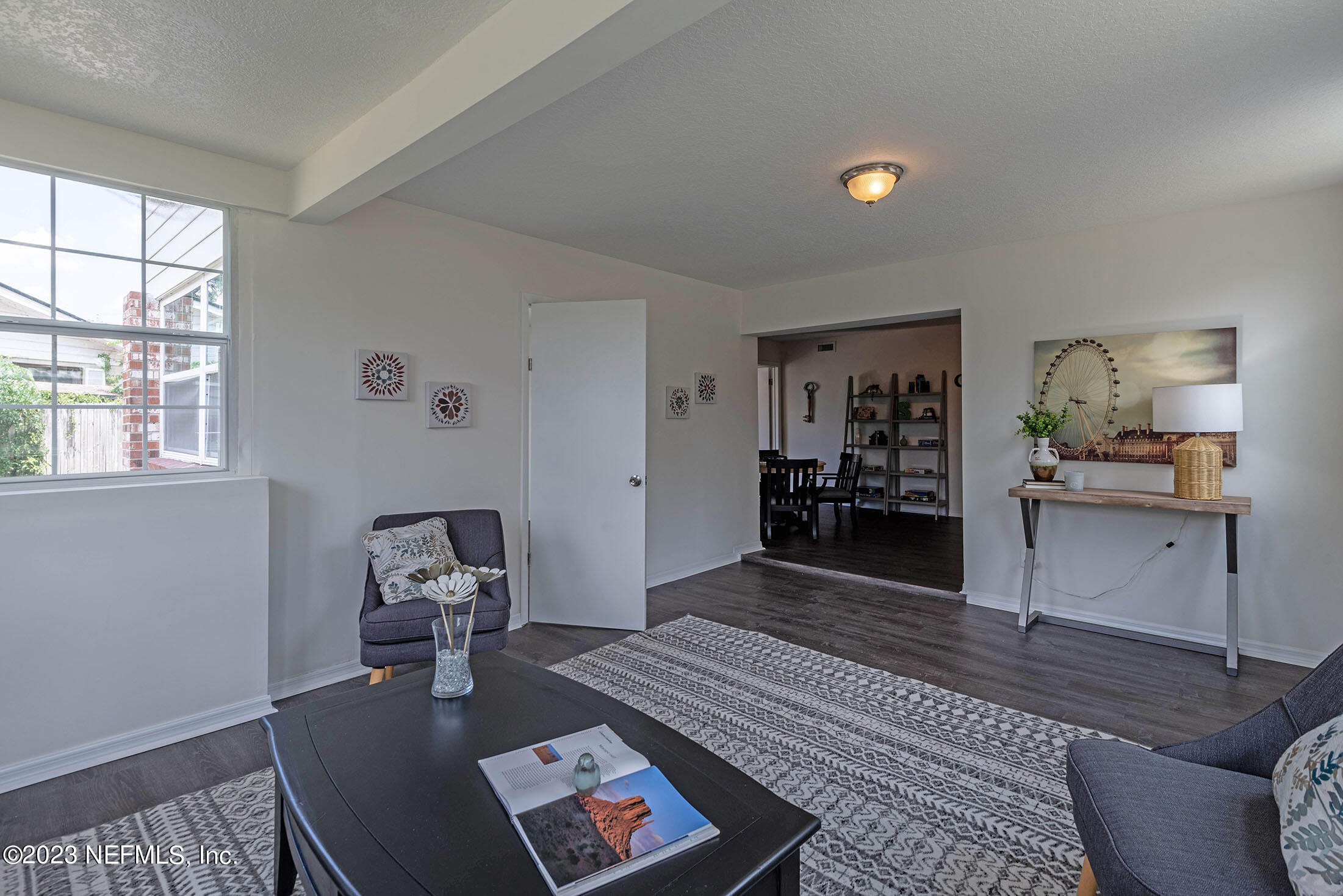 8007 Alderman Road Jacksonville, FL 32211 - Photo 21 of 63 a living room with furniture and a wooden floor