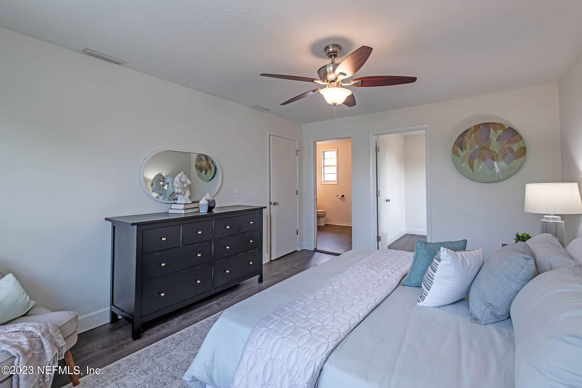8007 Alderman Road Jacksonville, FL 32211 - Photo 33 of 63 a bedroom with a bed and a chandelier