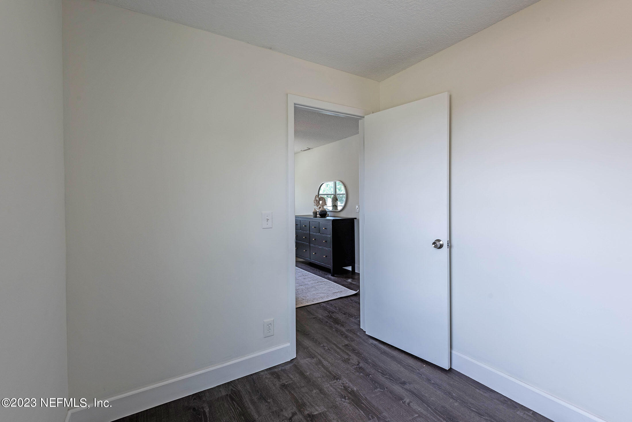 8007 Alderman Road Jacksonville, FL 32211 - Photo 35 of 63 a view of an empty room and wooden floor