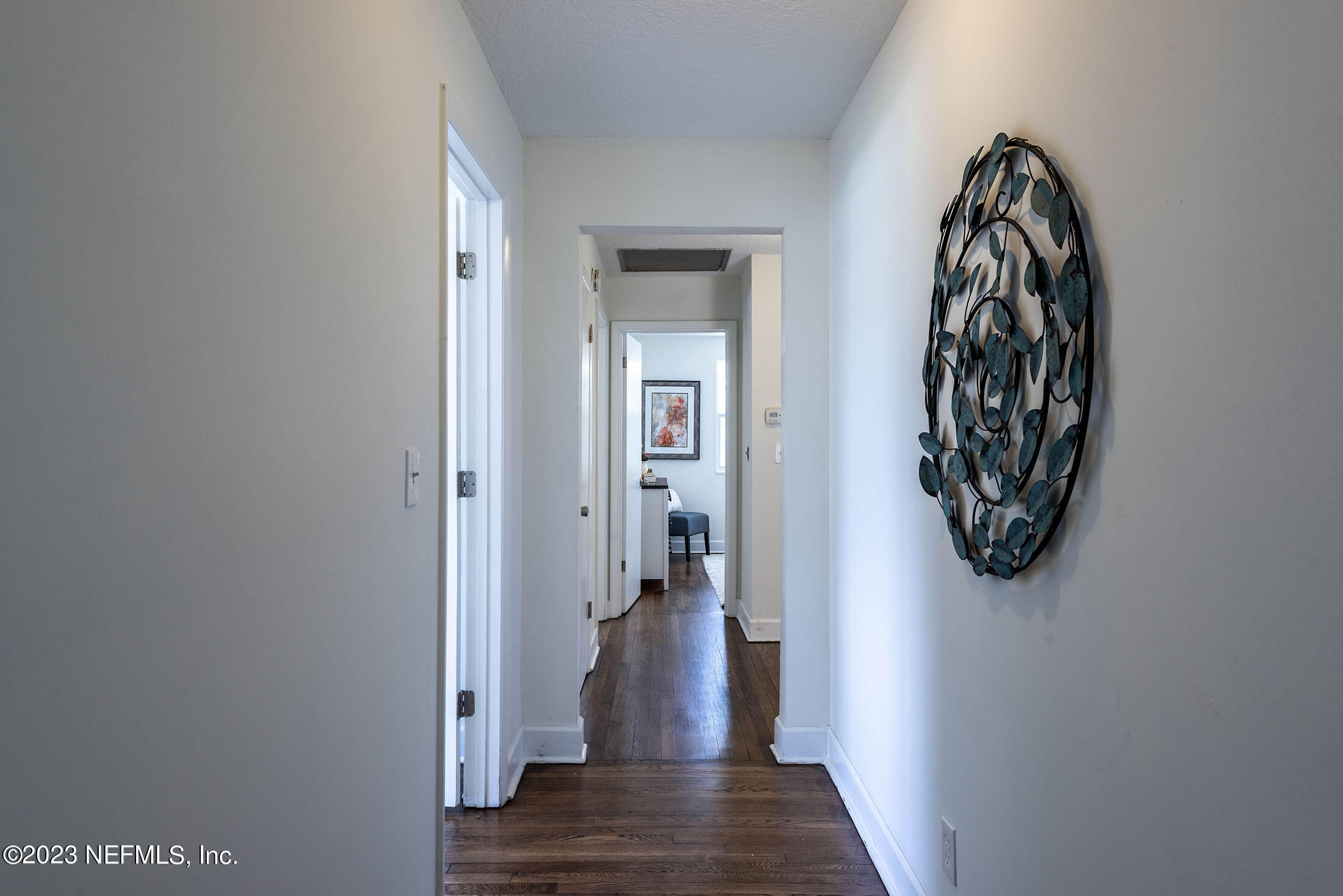 8007 Alderman Road Jacksonville, FL 32211 - Photo 39 of 63 a view of a hallway with wooden floor and closet