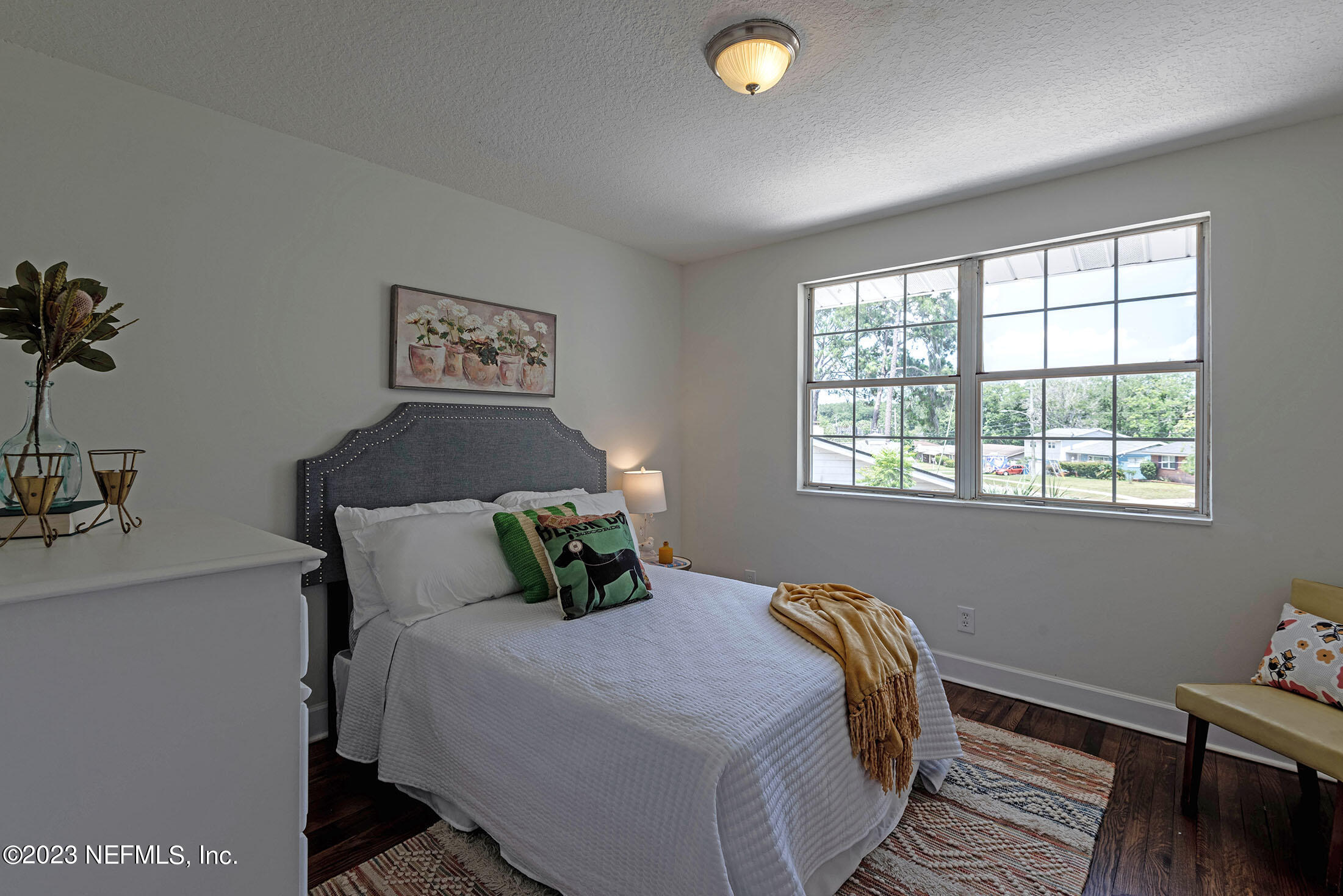 8007 Alderman Road Jacksonville, FL 32211 - Photo 40 of 63 a bedroom with a bed and wooden floor
