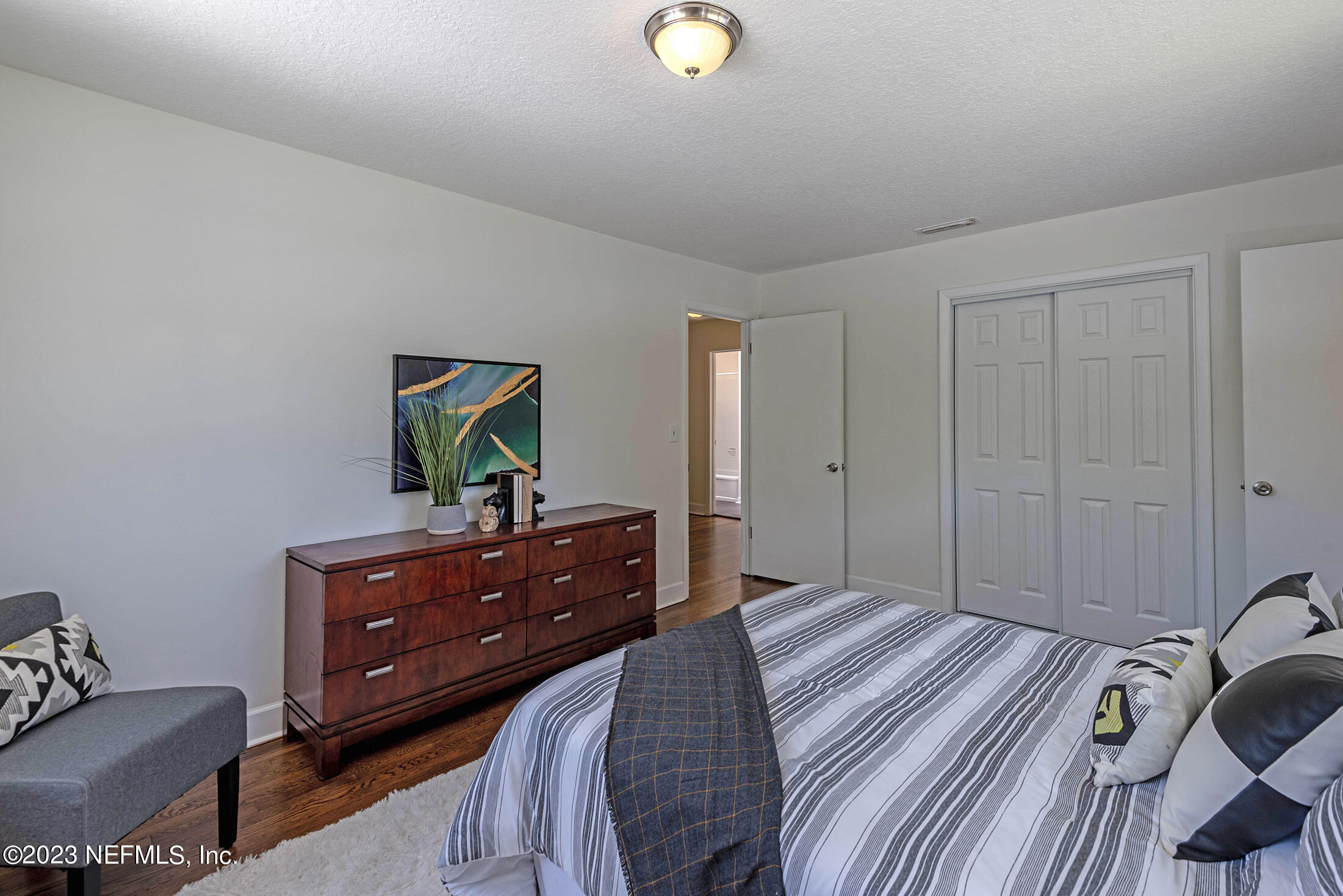 8007 Alderman Road Jacksonville, FL 32211 - Photo 45 of 63 a bedroom with a bed and a dresser in it