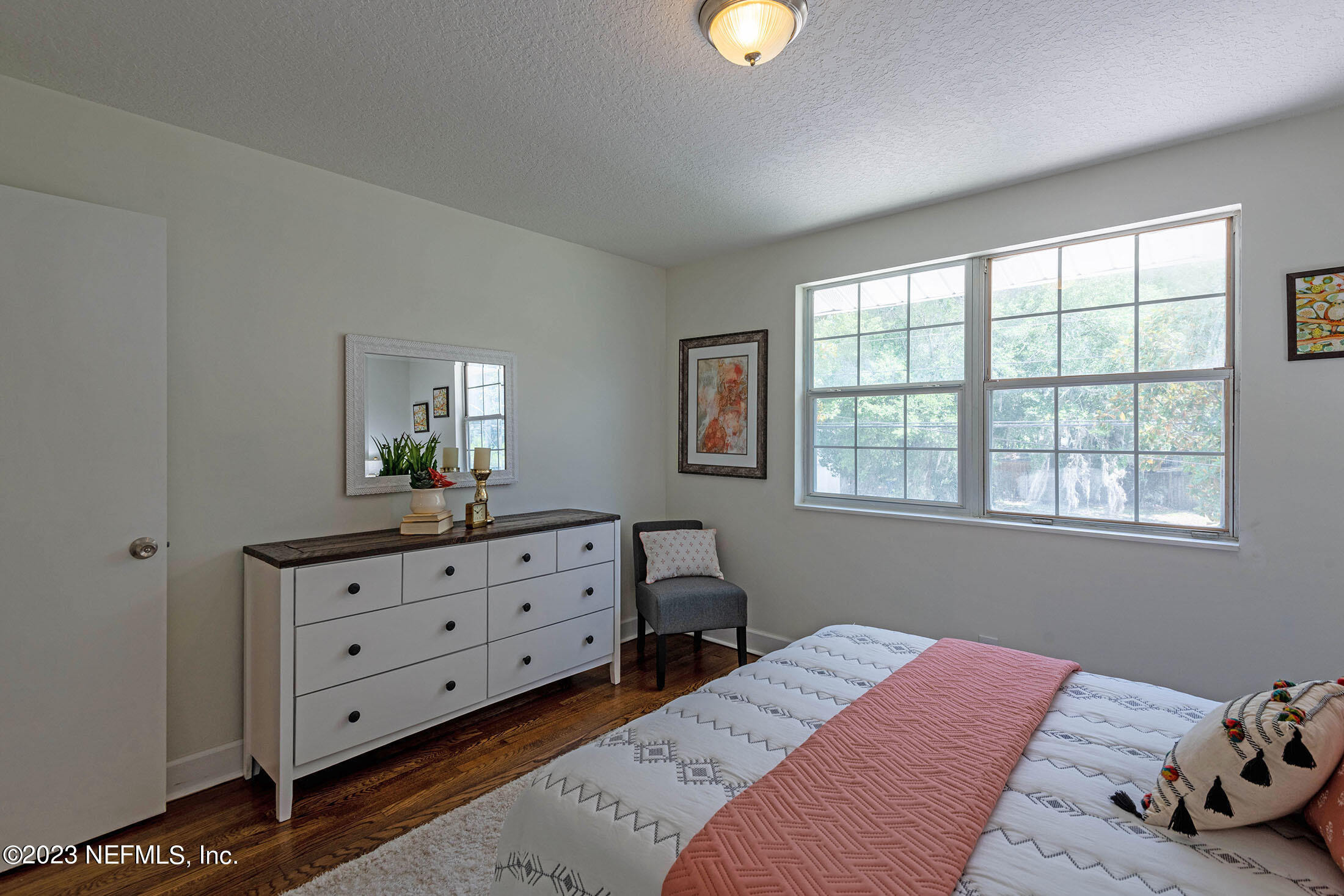 8007 Alderman Road Jacksonville, FL 32211 - Photo 49 of 63 a bed room with a bed and a dresser