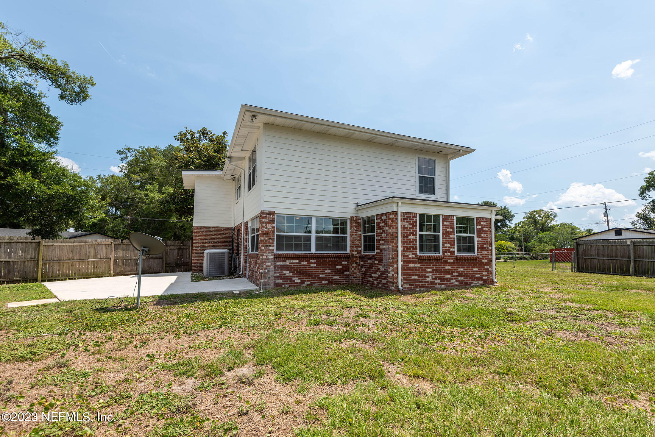 8007 Alderman Road Jacksonville, FL 32211 - Photo 53 of 63 a view of a house with a yard and sitting area