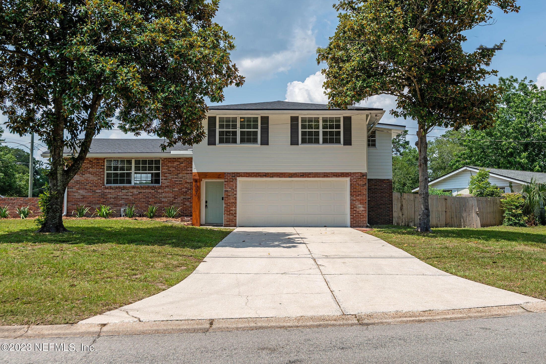 8007 Alderman Road Jacksonville, FL 32211 - Photo 59 of 63 a front view of a house with a garden