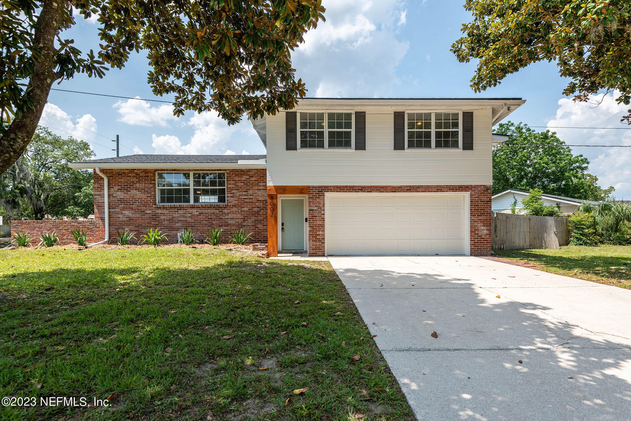 8007 Alderman Road Jacksonville, FL 32211 - Photo 62 of 63 a front view of a house with a garden