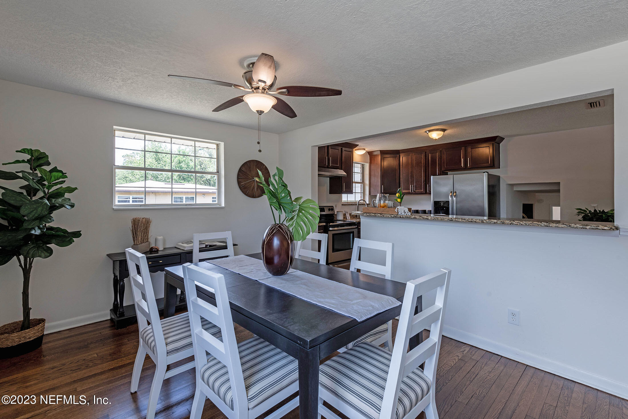8007 Alderman Road Jacksonville, FL 32211 - Photo 8 of 63 a view of a dining room with furniture window and wooden floor