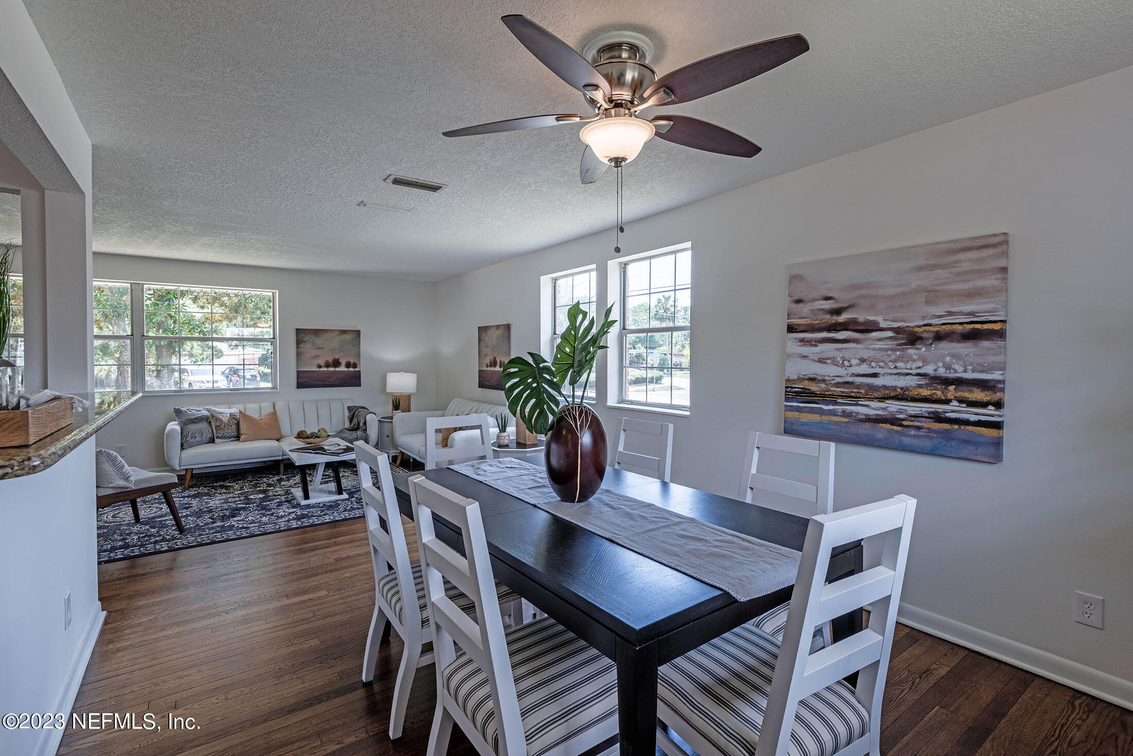 8007 Alderman Road Jacksonville, FL 32211 - Photo 9 of 63 a dining room with furniture a window and wooden floor