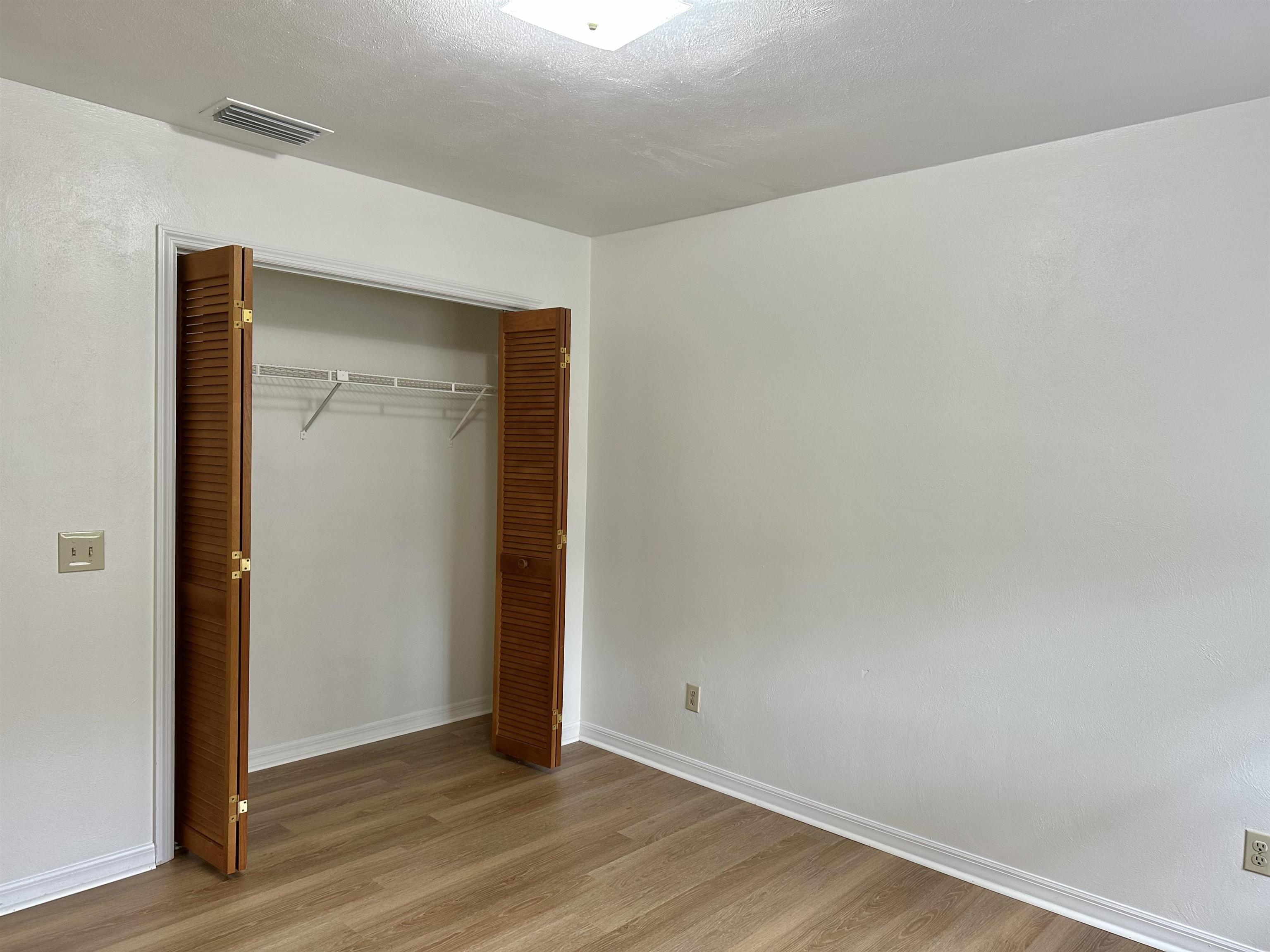 120 Vassar Road St. Augustine South, FL 32086 - Photo 11 of 24 a view of an empty room with wooden floor