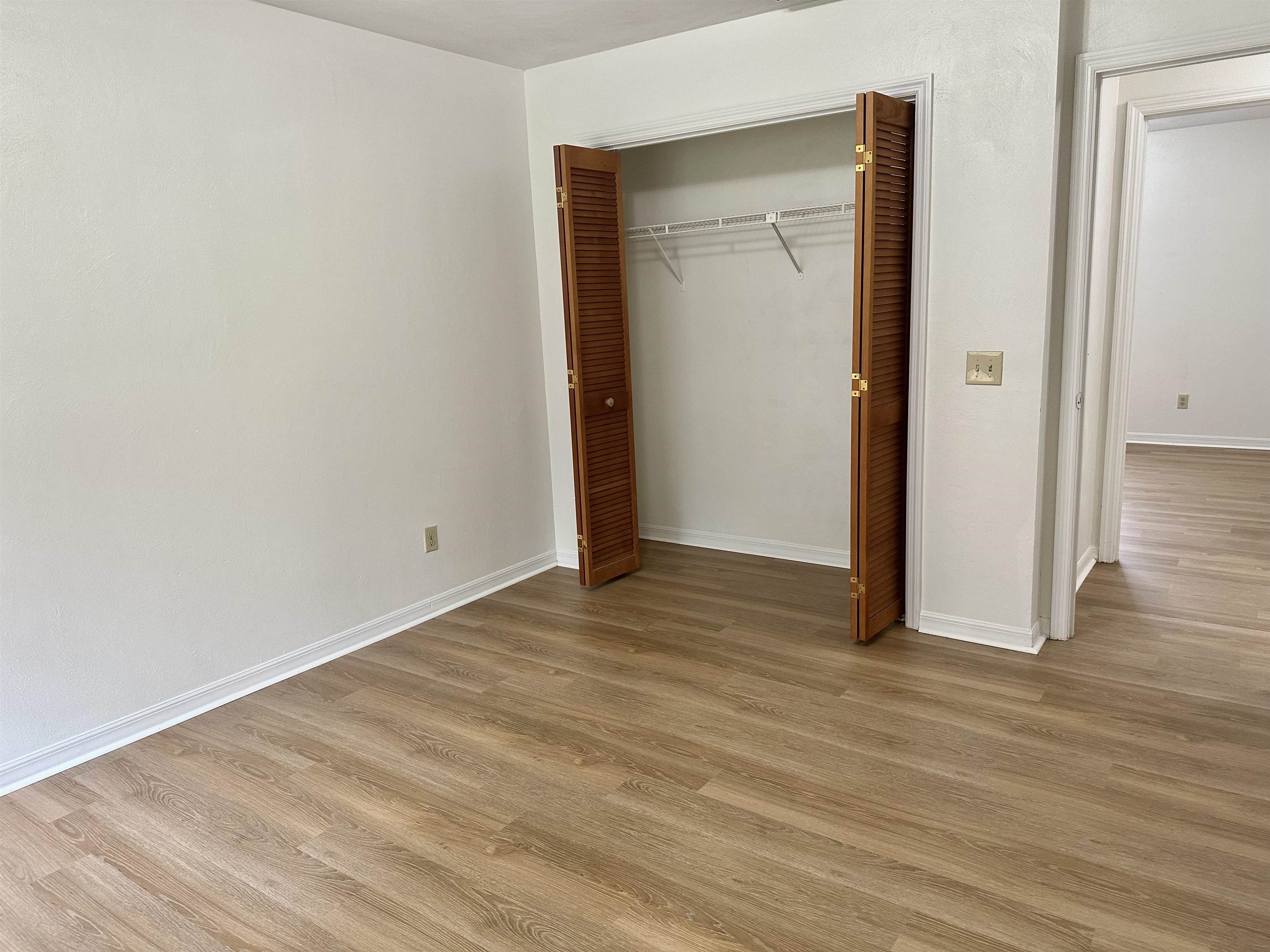 120 Vassar Road St. Augustine South, FL 32086 - Photo 17 of 24 a view of an empty room with wooden floor and closet