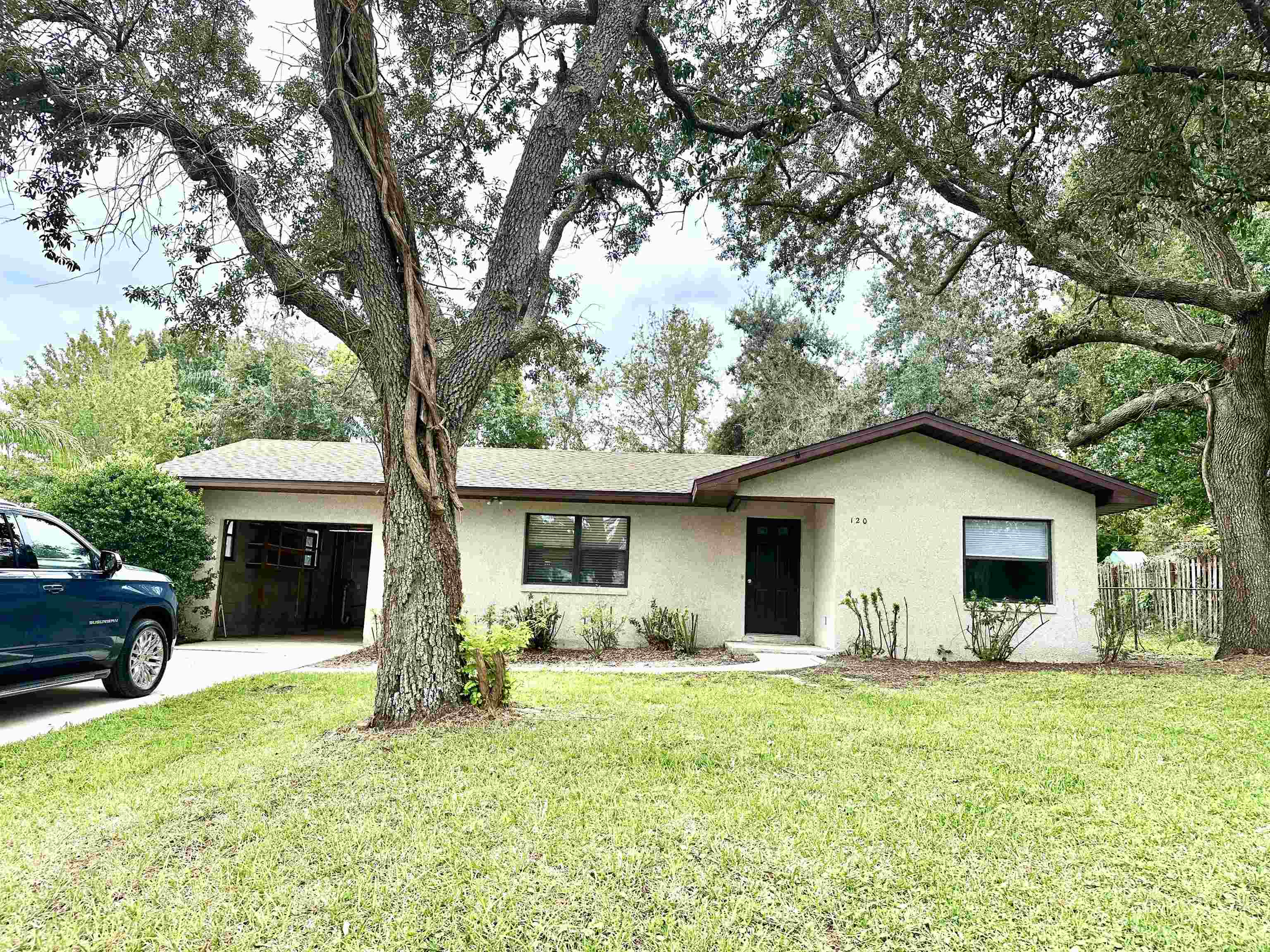 120 Vassar Road St. Augustine South, FL 32086 - Photo 24 of 24 a front view of house with yard and trees in the background