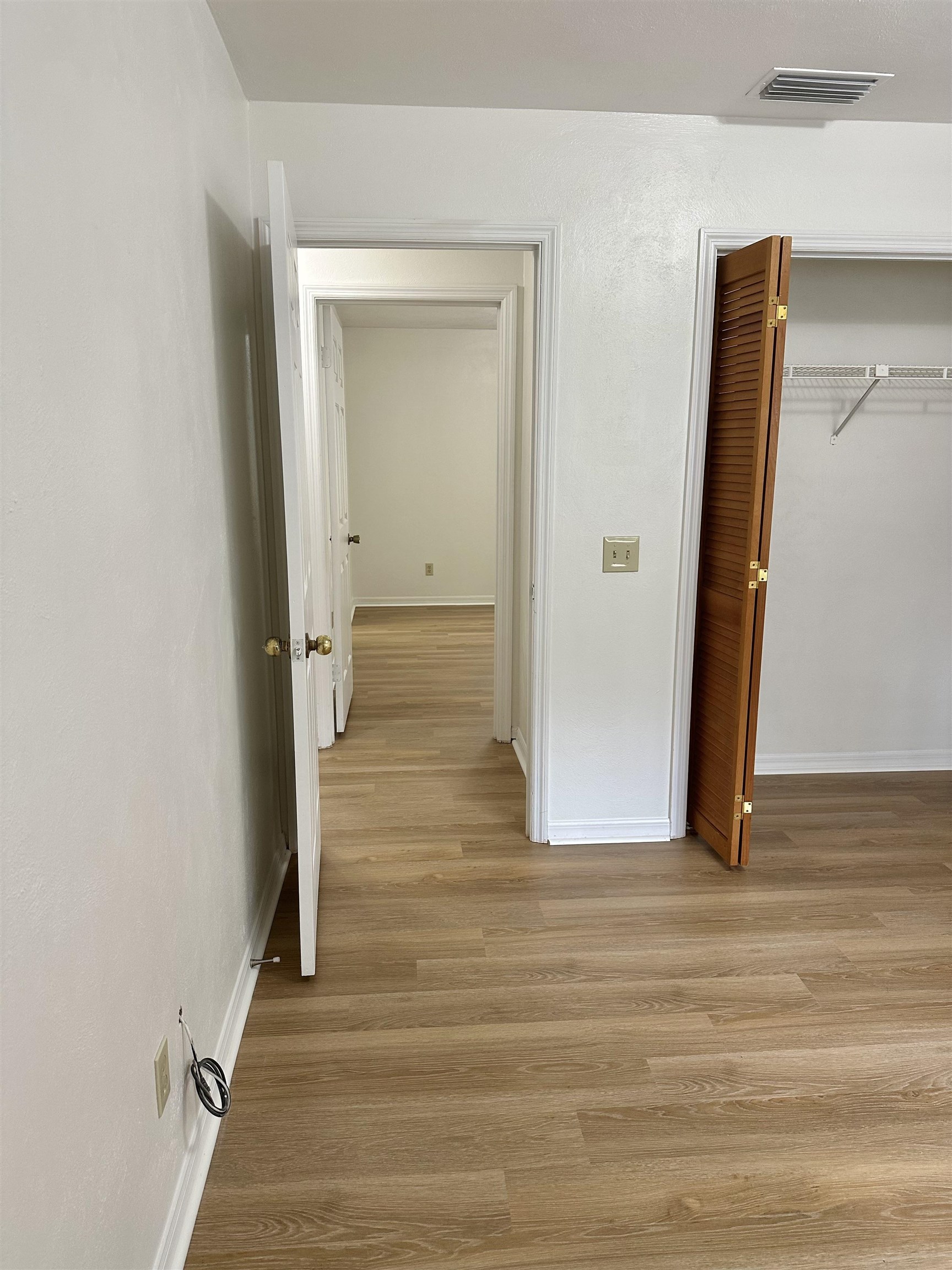 120 Vassar Road St. Augustine South, FL 32086 - Photo 10 of 24 a view of a hallway with wooden floor and staircase