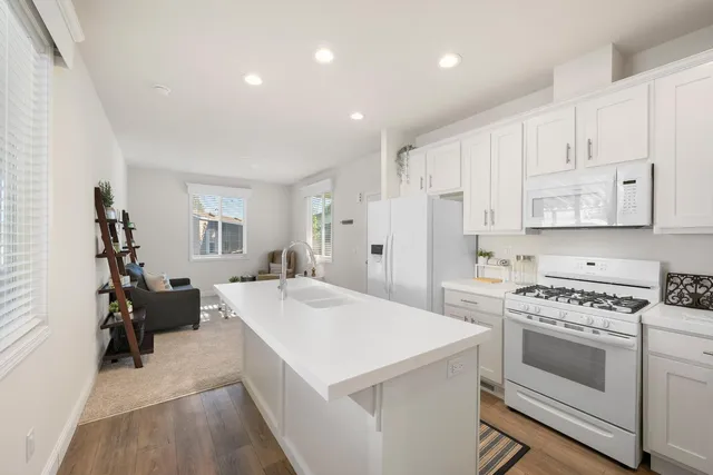 a kitchen that has a stove and a refrigerator
