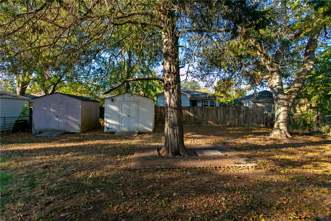 903 Travis Street Bryan, TX 77803 - Photo 20 of 20 a backyard of a house with lots of green space