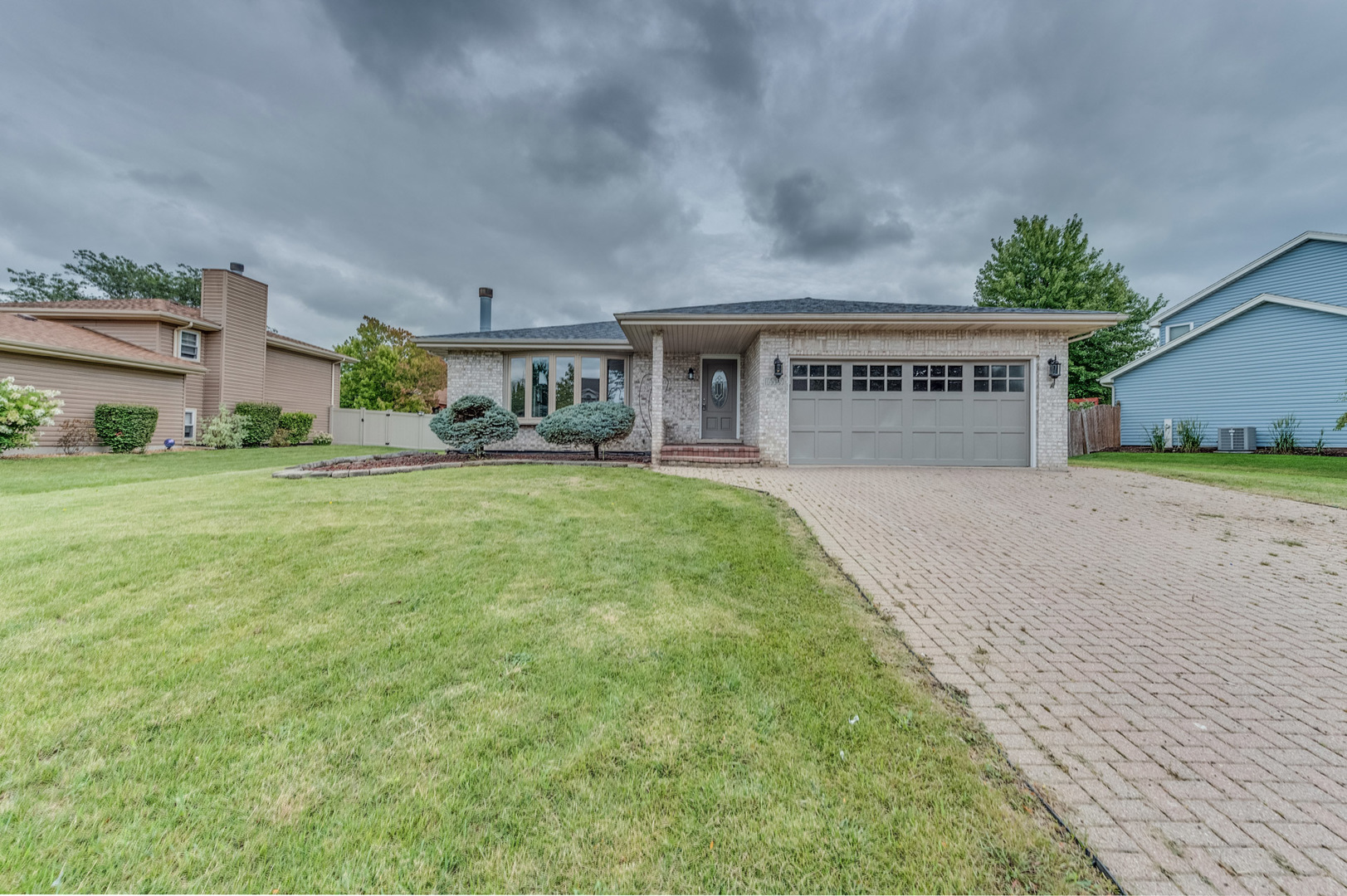 a view of house with outdoor space and garden