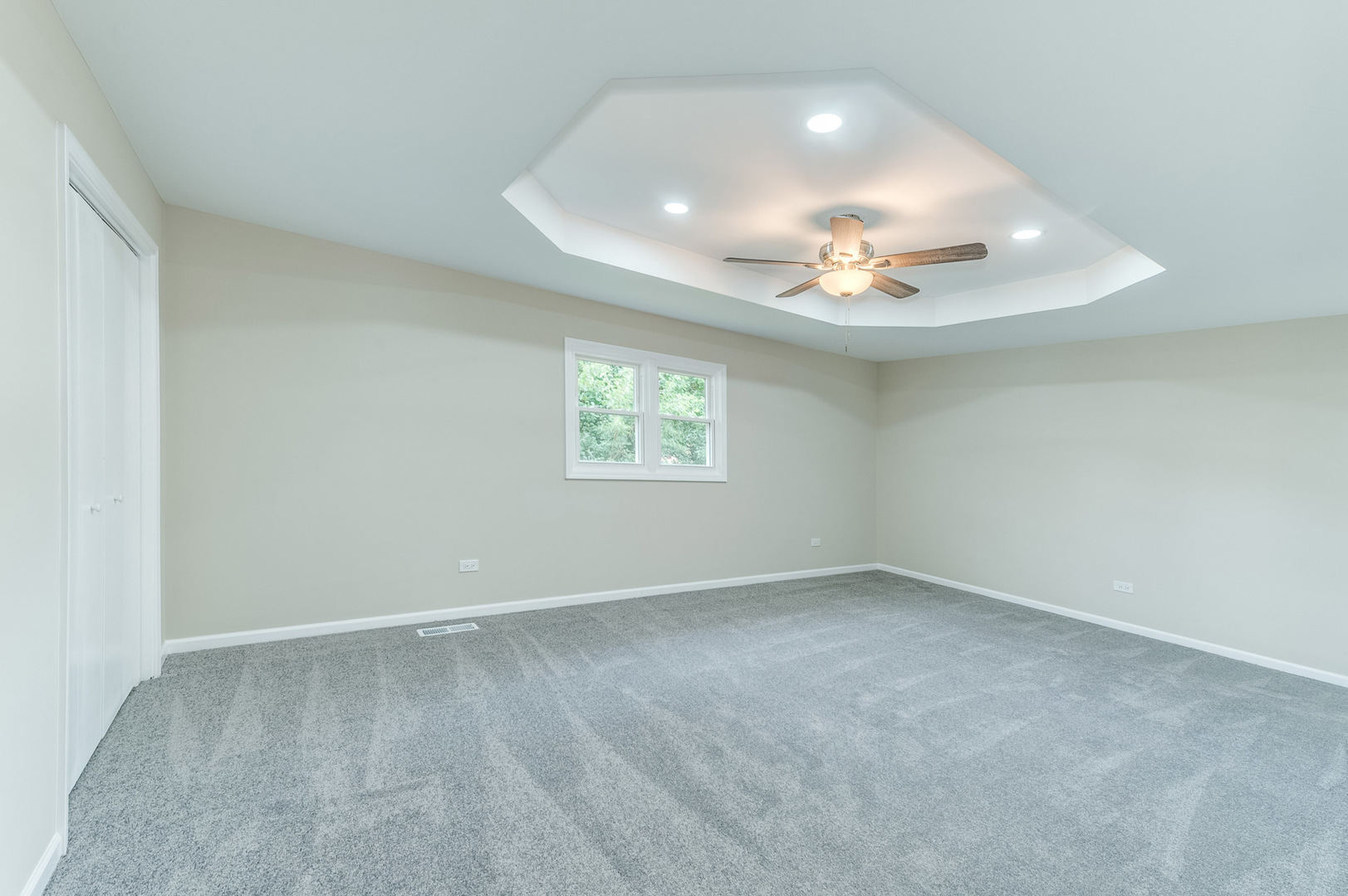 16539 Timberview Drive Plainfield, IL 60586 - Photo 14 of 26 an empty room with a window and a chandelier fan