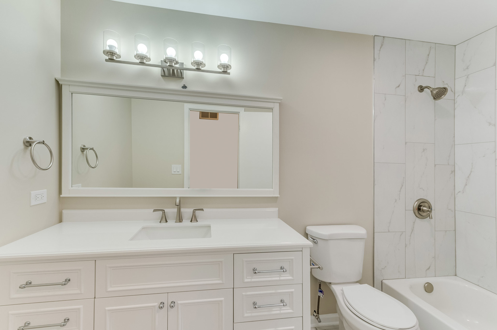 16539 Timberview Drive Plainfield, IL 60586 - Photo 18 of 26 a bathroom with a sink a toilet and shower