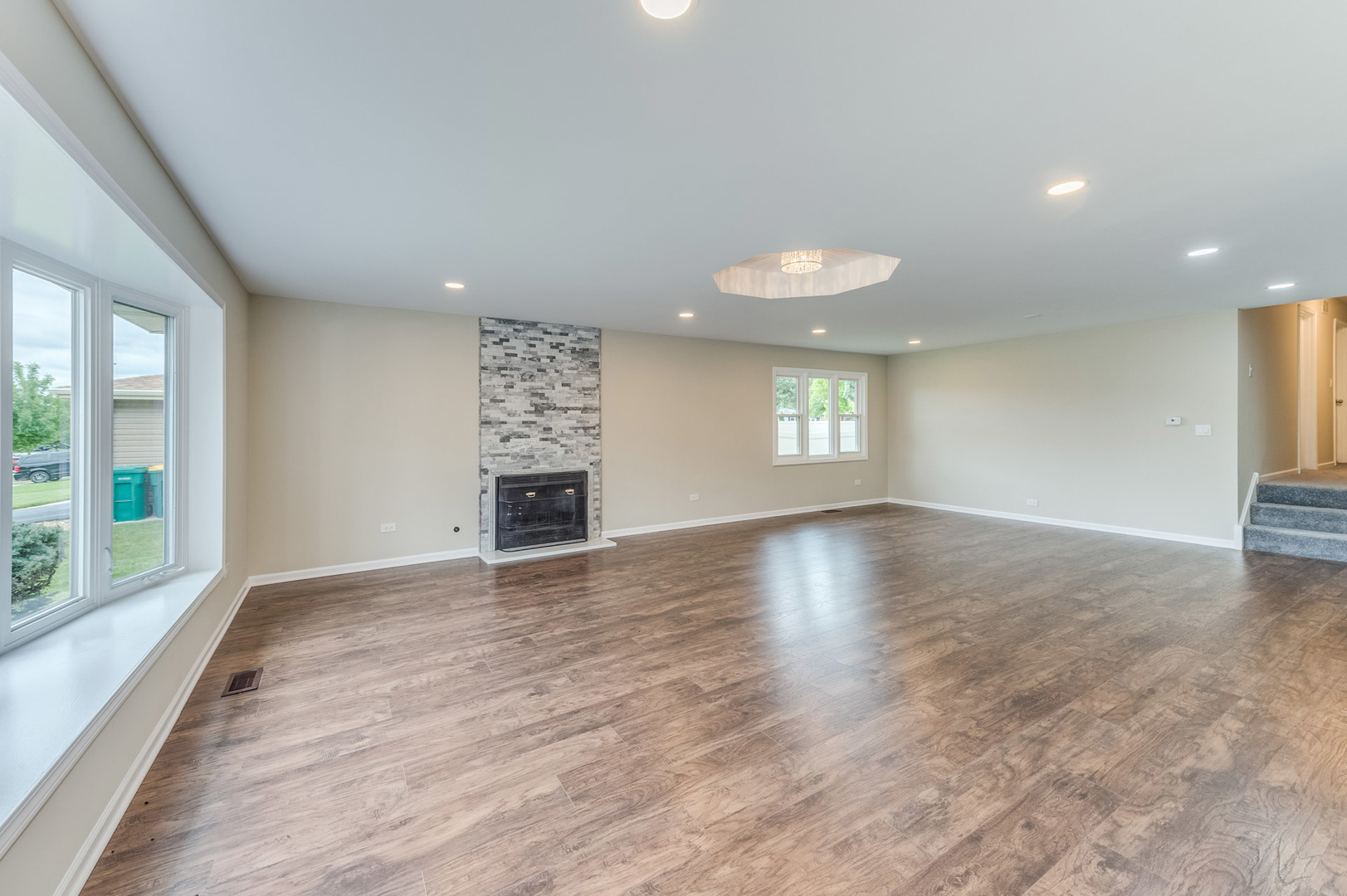 16539 Timberview Drive Plainfield, IL 60586 - Photo 4 of 26 a view of empty room with wooden floor and fan