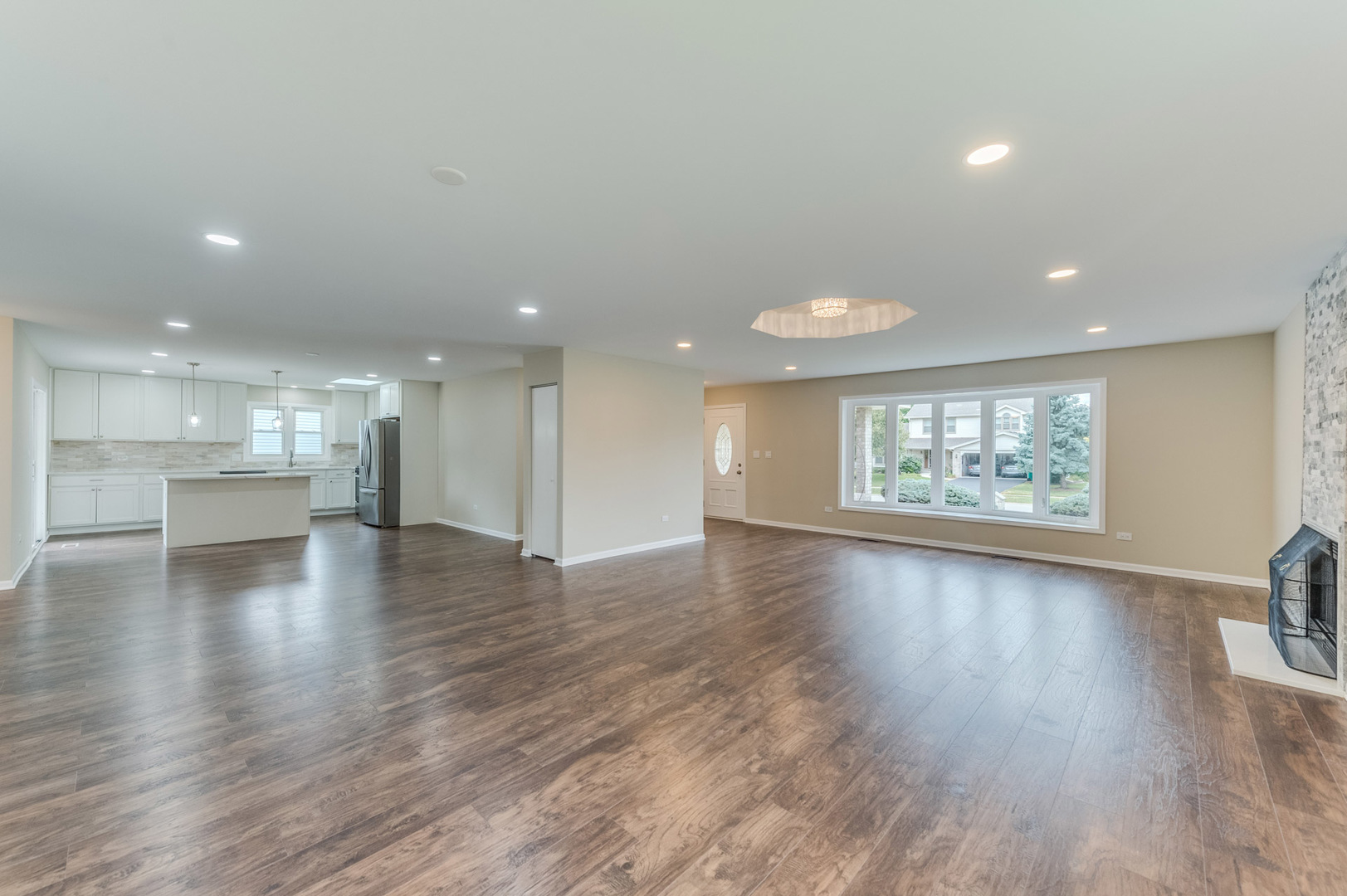 16539 Timberview Drive Plainfield, IL 60586 - Photo 6 of 26 a view of an empty room with wooden floor and a window