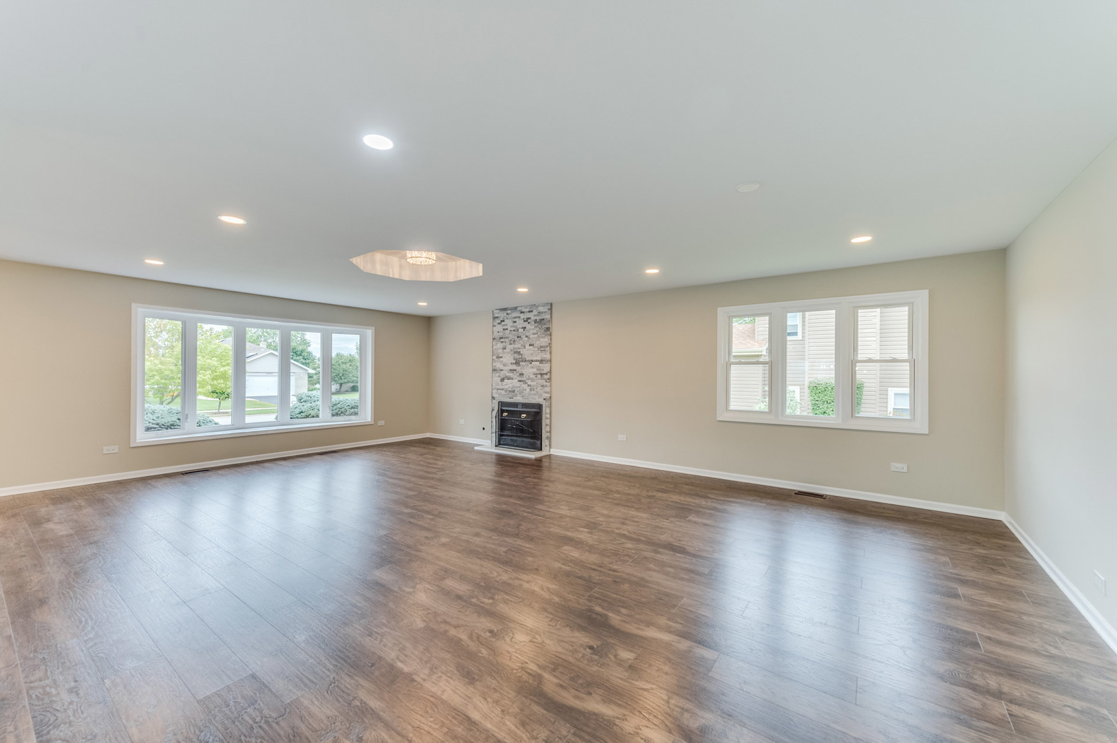 16539 Timberview Drive Plainfield, IL 60586 - Photo 7 of 26 a view of an empty room with wooden floor and a window