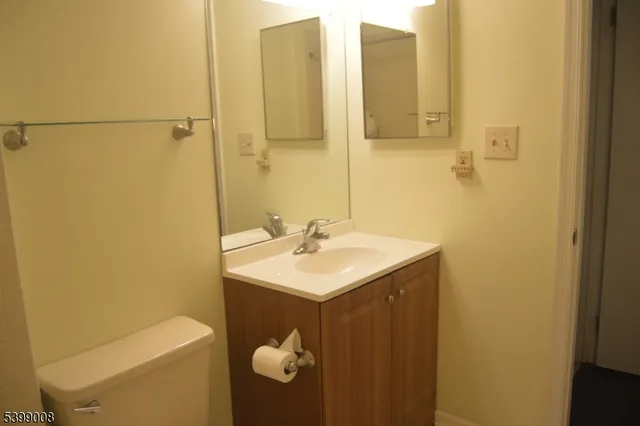 a bathroom with a sink and mirror