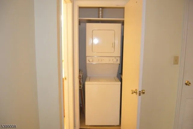 a bathroom with a glass door and a window