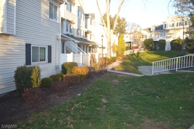 a view of a backyard with sitting area and entertaining space