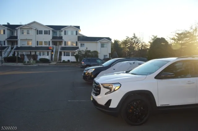 a front view of a house with parking space