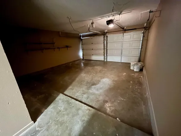 a view of a living room with hardwood floor and a ceiling fan