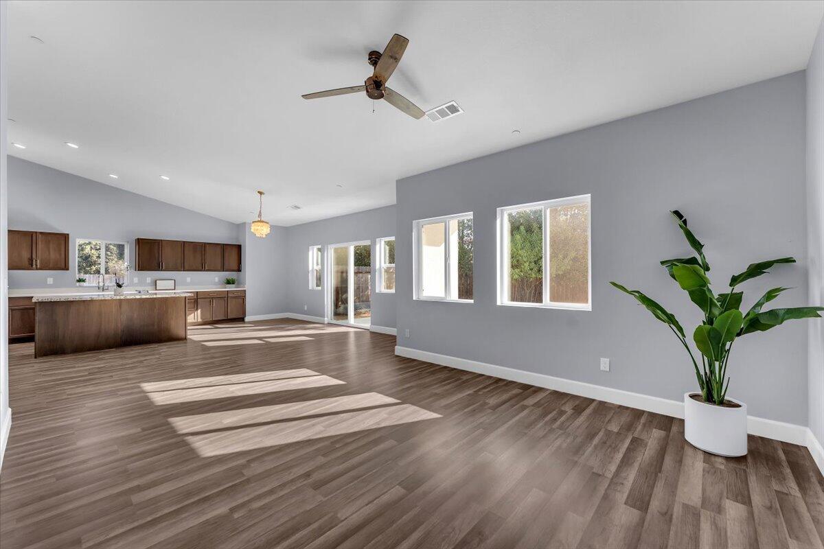 1565 Carl Court Red Bluff, CA 96080 - Photo 12 of 49 a view of kitchen with microwave and wooden floor