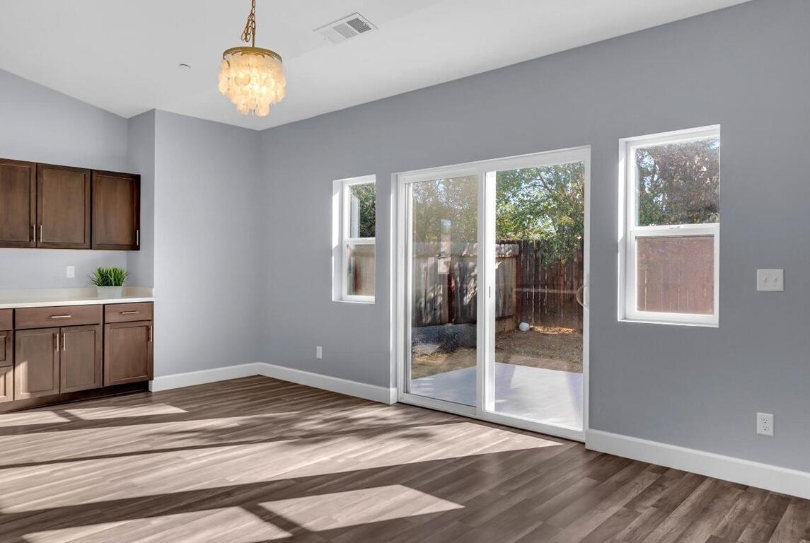 1565 Carl Court Red Bluff, CA 96080 - Photo 14 of 49 a view of a kitchen with a sink and dishwasher cabinets