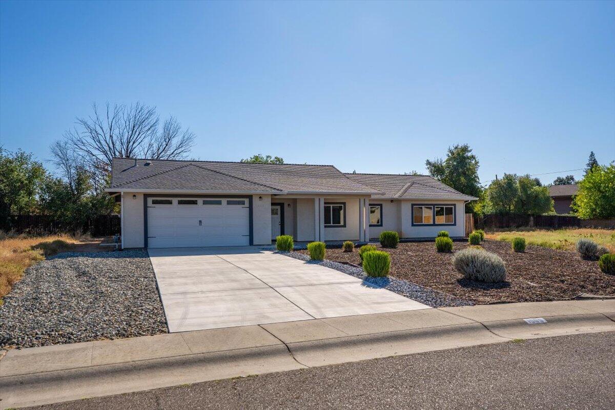1565 Carl Court Red Bluff, CA 96080 - Photo 2 of 49 a front view of a house with garden
