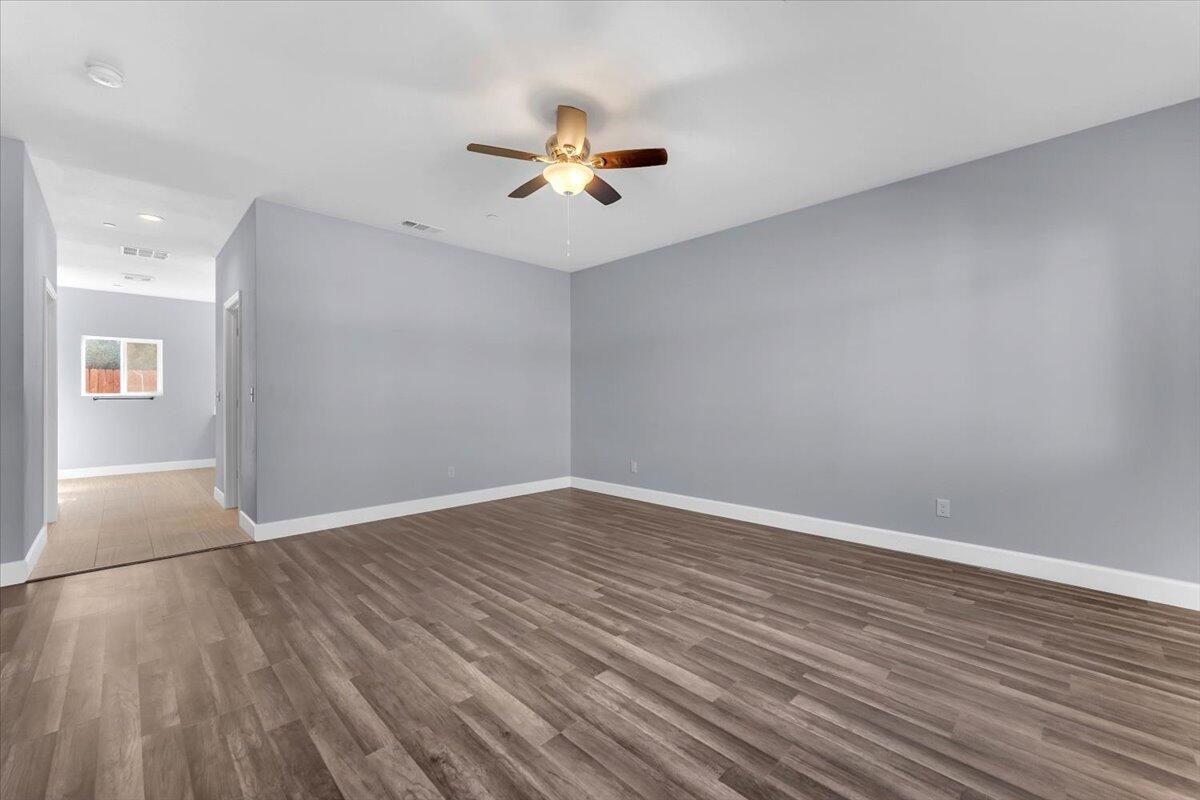 1565 Carl Court Red Bluff, CA 96080 - Photo 24 of 49 wooden floor in an empty room with a window