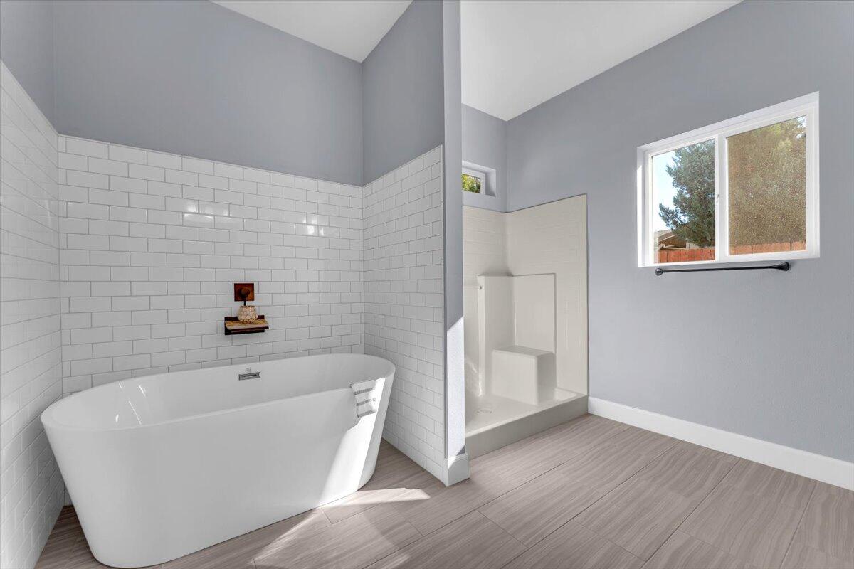 1565 Carl Court Red Bluff, CA 96080 - Photo 28 of 49 a white bath tub sitting in a bathroom