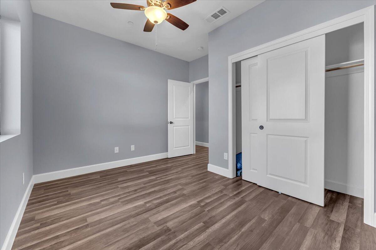 1565 Carl Court Red Bluff, CA 96080 - Photo 32 of 49 a view of an empty room with wooden floor
