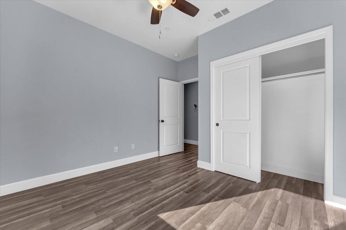 1565 Carl Court Red Bluff, CA 96080 - Photo 35 of 49 a view of an empty room with wooden floor