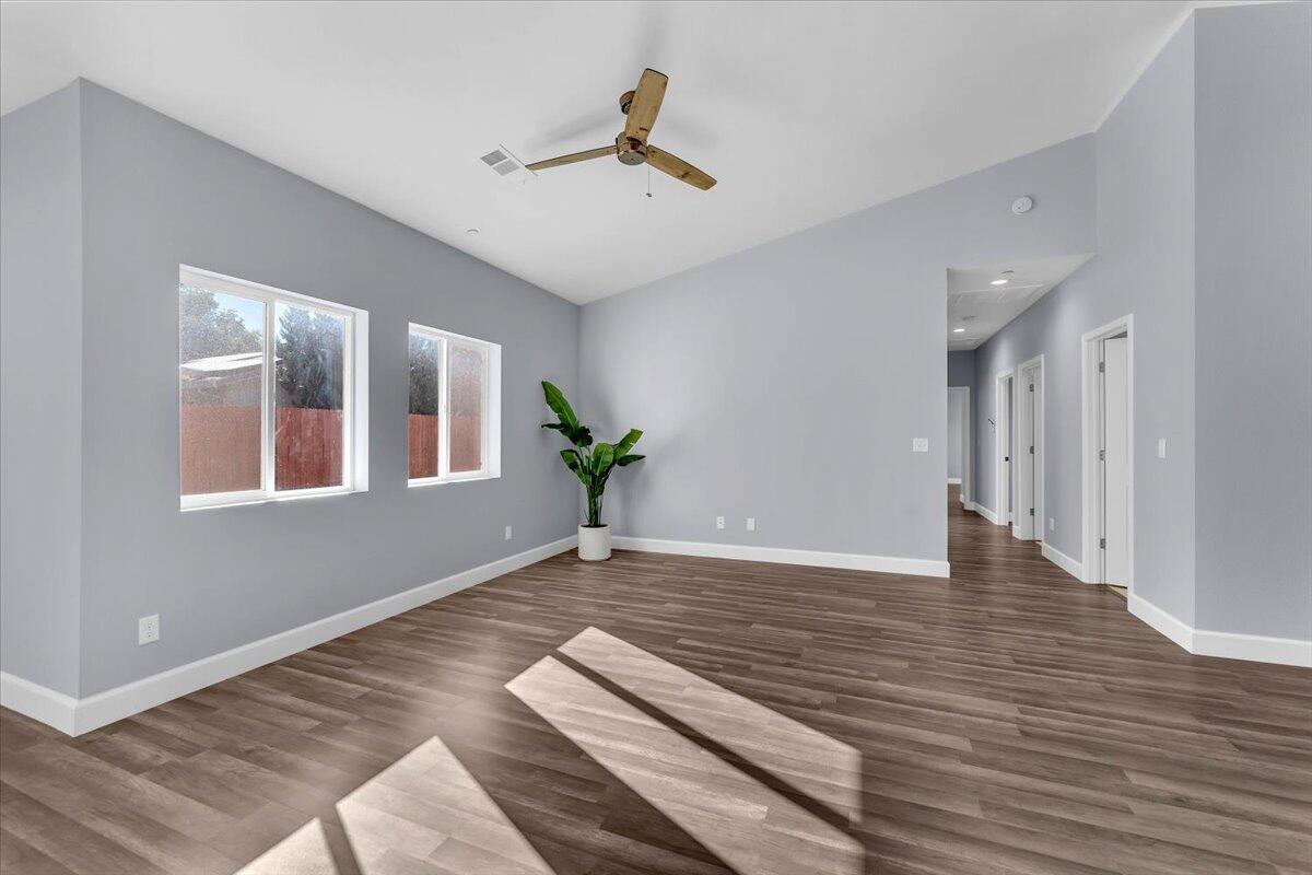 1565 Carl Court Red Bluff, CA 96080 - Photo 10 of 49 a view of an empty room with wooden floor and a window