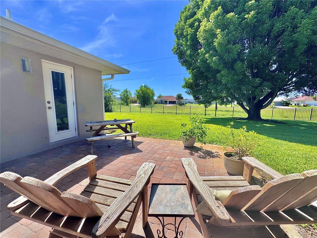 9405 Spring Circle Port Charlotte, FL 33981 - Photo 19 of 24 a view of a patio with a yard