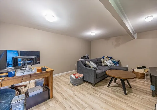 a work room with furniture and wooden floor