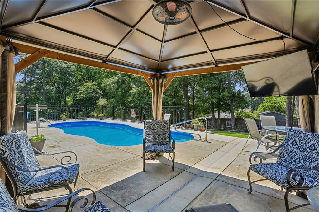 2740 Frontier Trail Atlanta, GA 30341 - Photo 5 of 29 a outdoor space with the couches and dining table with the garden view