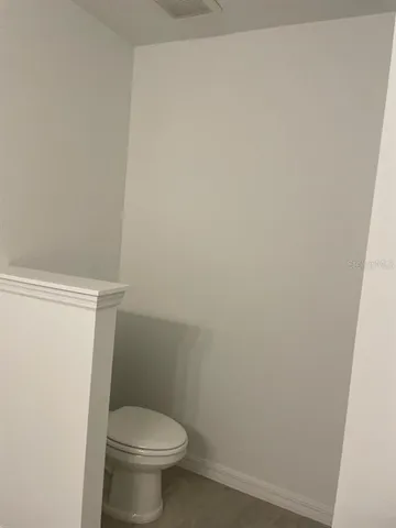 a bathroom with a shower a sink and a mirror