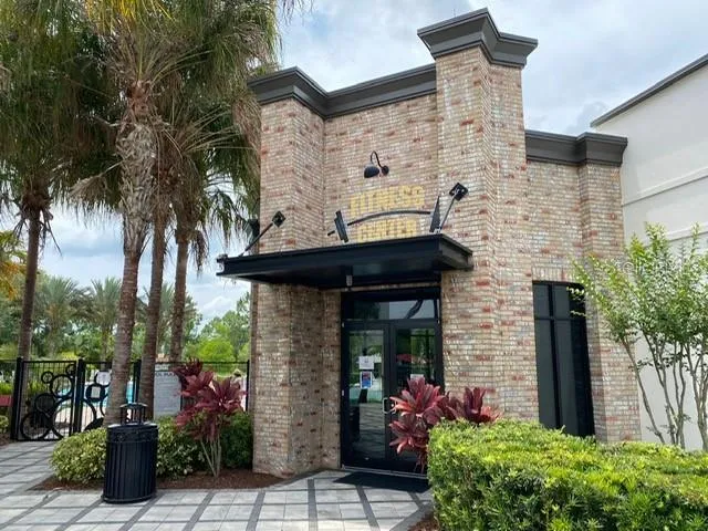 a front view of a building with garden