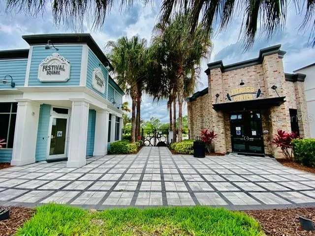 a view of swimming pool with outdoor seating
