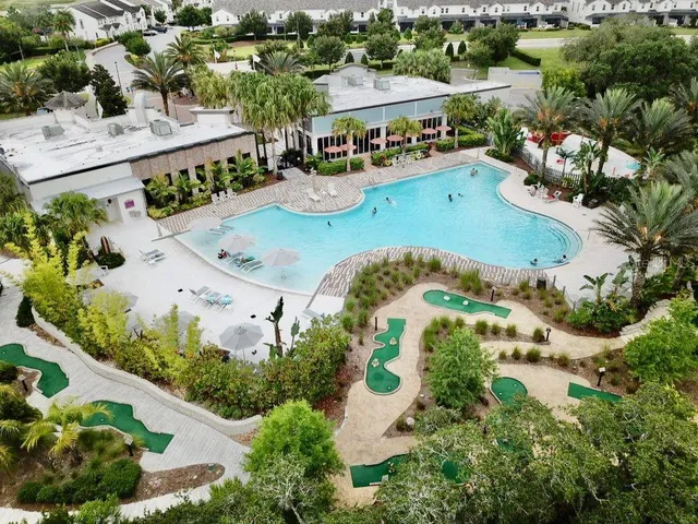 a front view of a house with garden and patio