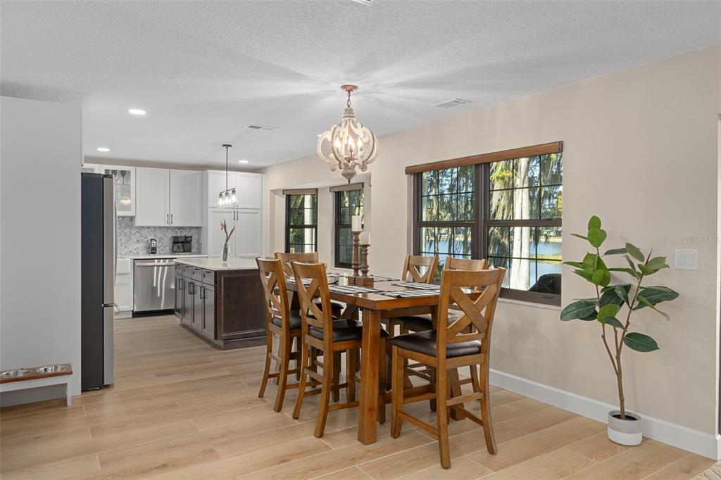 1425 South Homestead Point Inverness, FL 34450 - Photo 17 of 72 a view of a dining room with furniture window and wooden floor