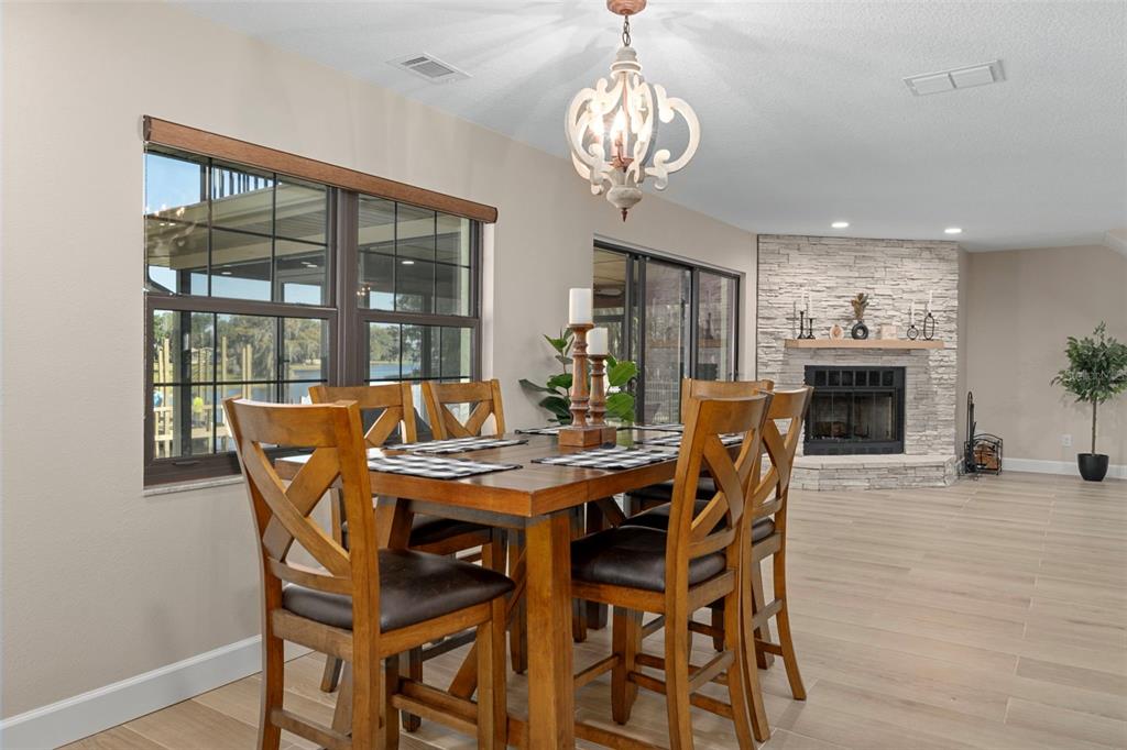 1425 South Homestead Point Inverness, FL 34450 - Photo 18 of 72 a view of a dining room with furniture wooden floor and chandelier
