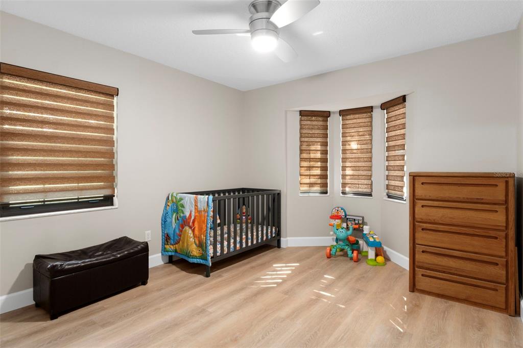 1425 South Homestead Point Inverness, FL 34450 - Photo 24 of 72 a living room with a baby crib furniture and a window