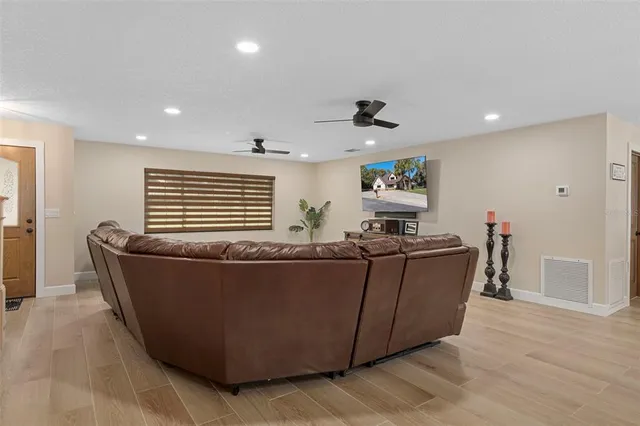 a view of a dining room with furniture wooden floor and chandelier