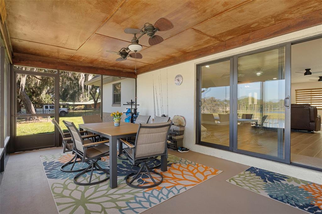 1425 South Homestead Point Inverness, FL 34450 - Photo 39 of 72 a dining room with furniture a chandelier and wooden floor